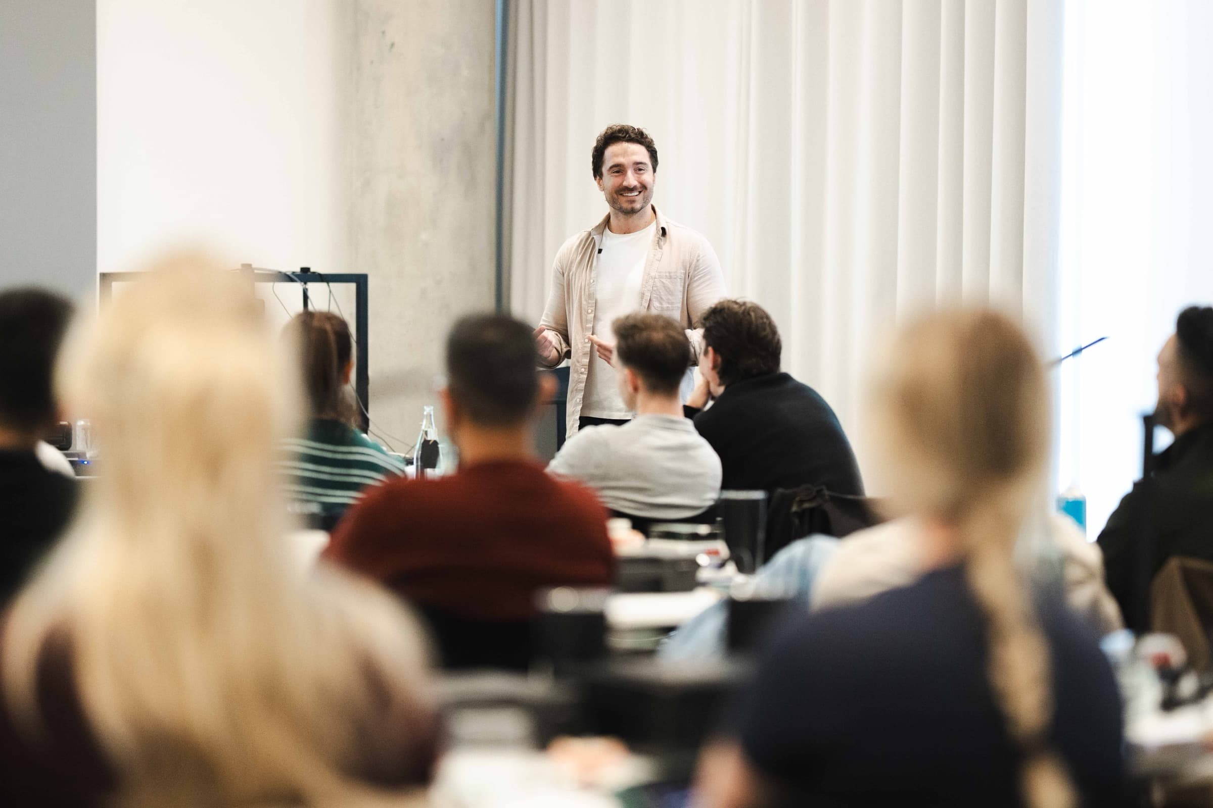 Dr Albert teaching a room of delegates at a Simplifi course